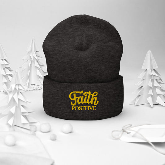 Faith Positive Cuffed Beanie. The Faith Positive logo is Embroidered with yellow thread on the cuff of the beanie. Hat is dark grey heather in color.