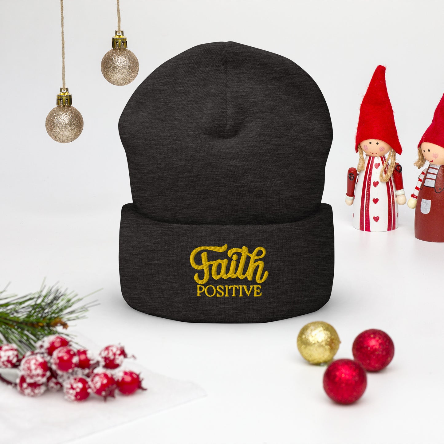 Faith Positive Cuffed Beanie. The Faith Positive logo is Embroidered with yellow thread on the cuff of the beanie. Hat is dark grey heather in color.