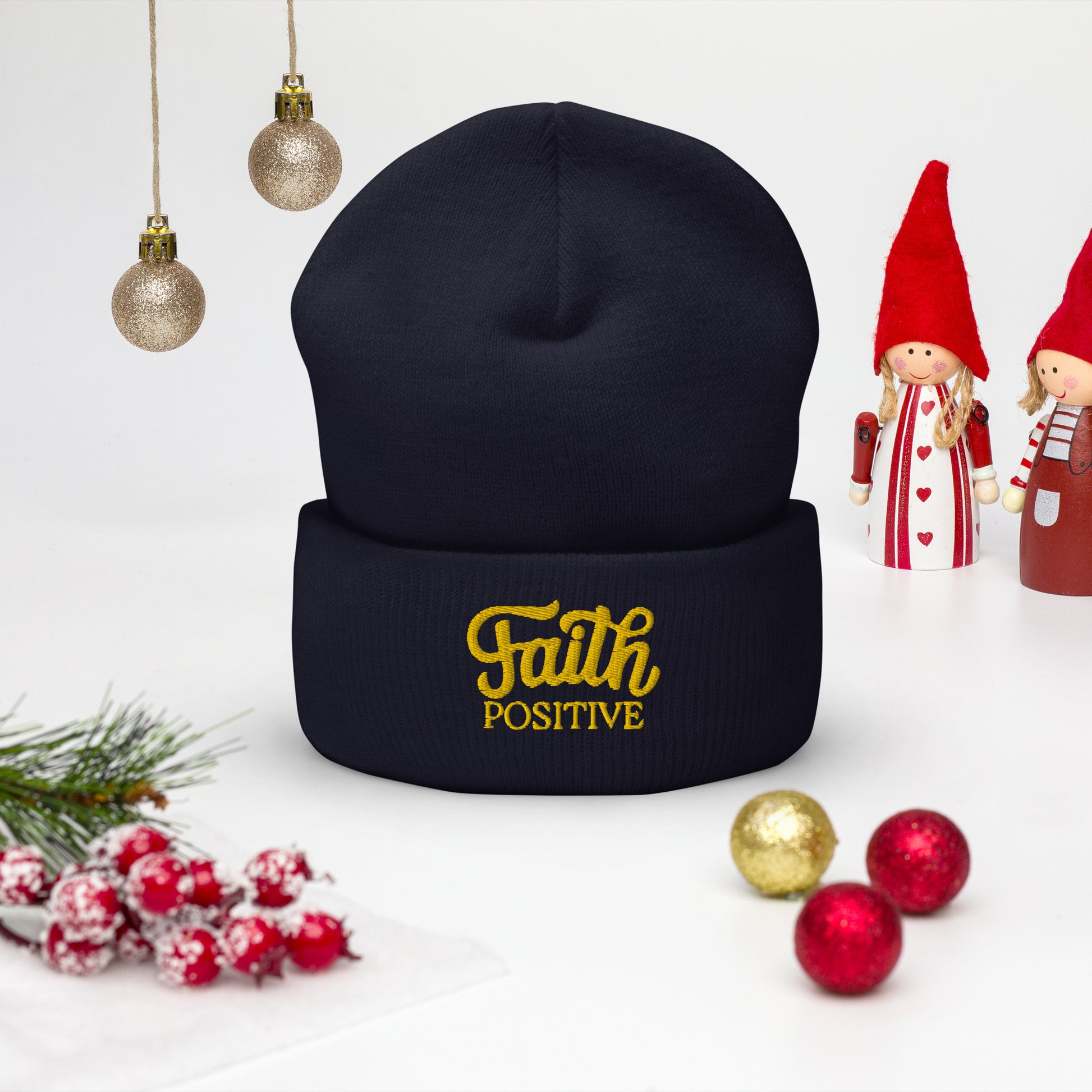 Faith Positive Cuffed Beanie. The Faith Positive logo is Embroidered with yellow thread on the cuff of the beanie. Hat is navy blue in color.