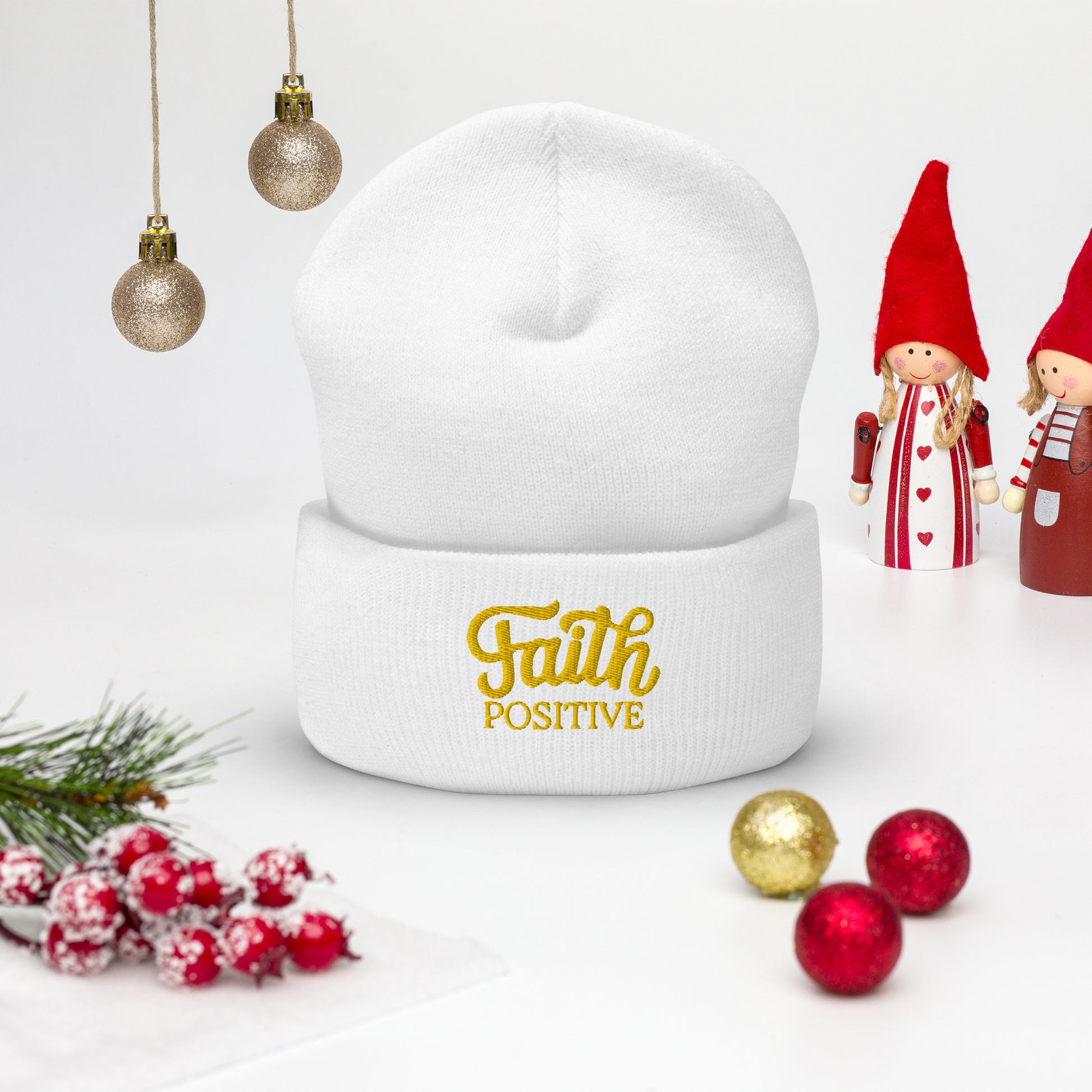 Faith Positive Cuffed Beanie. The Faith Positive logo is Embroidered with yellow thread on the cuff of the beanie. Hat is white in color.