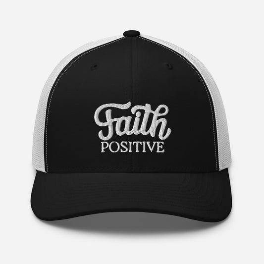 This is the Faith Positive Original trucker hat. The Faith Positive logo is embroidered on the front with white thread. This hat has a white mesh back with a black front and bill. This is the front view of the product.