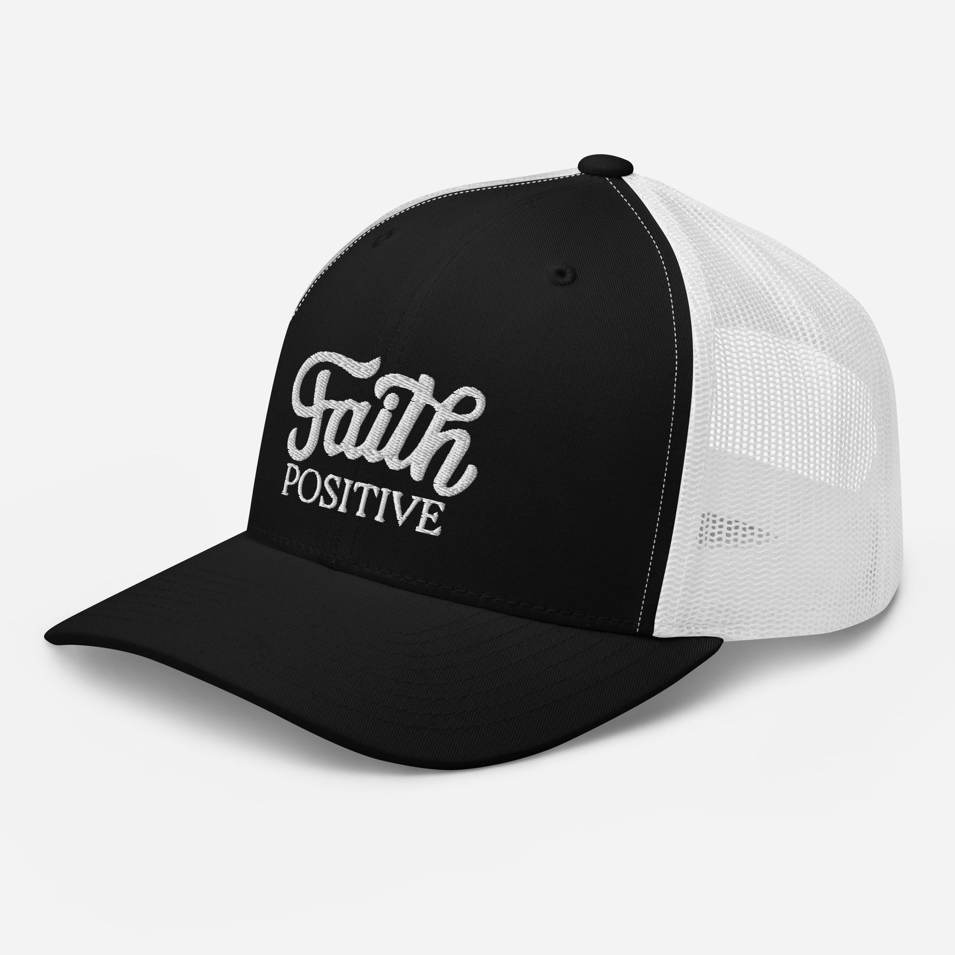 This is the Faith Positive Original trucker hat. The Faith Positive logo is embroidered on the front with white thread. This hat has a white mesh back with a black front and bill. This is a side view of the product.