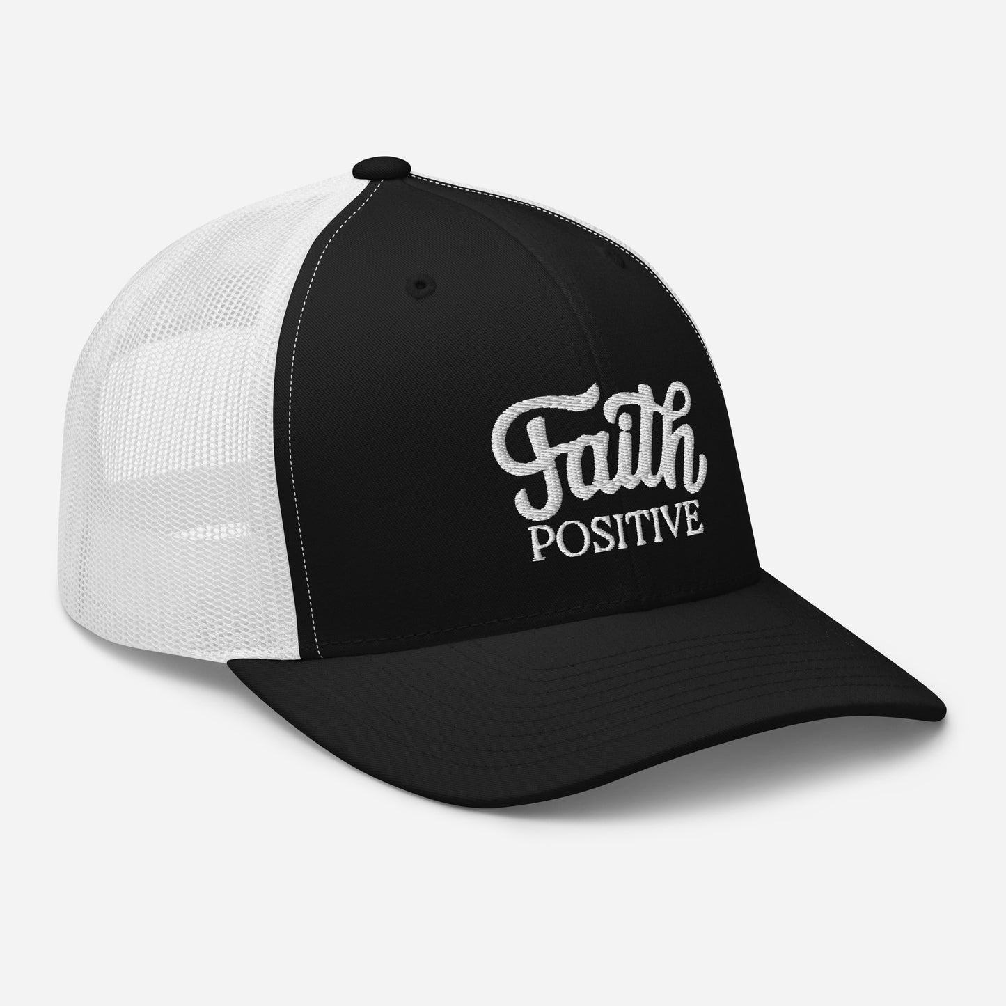 This is the Faith Positive Original trucker hat. The Faith Positive logo is embroidered on the front with white thread. This hat has a white mesh back with a black front and bill. This is the side view of the product.