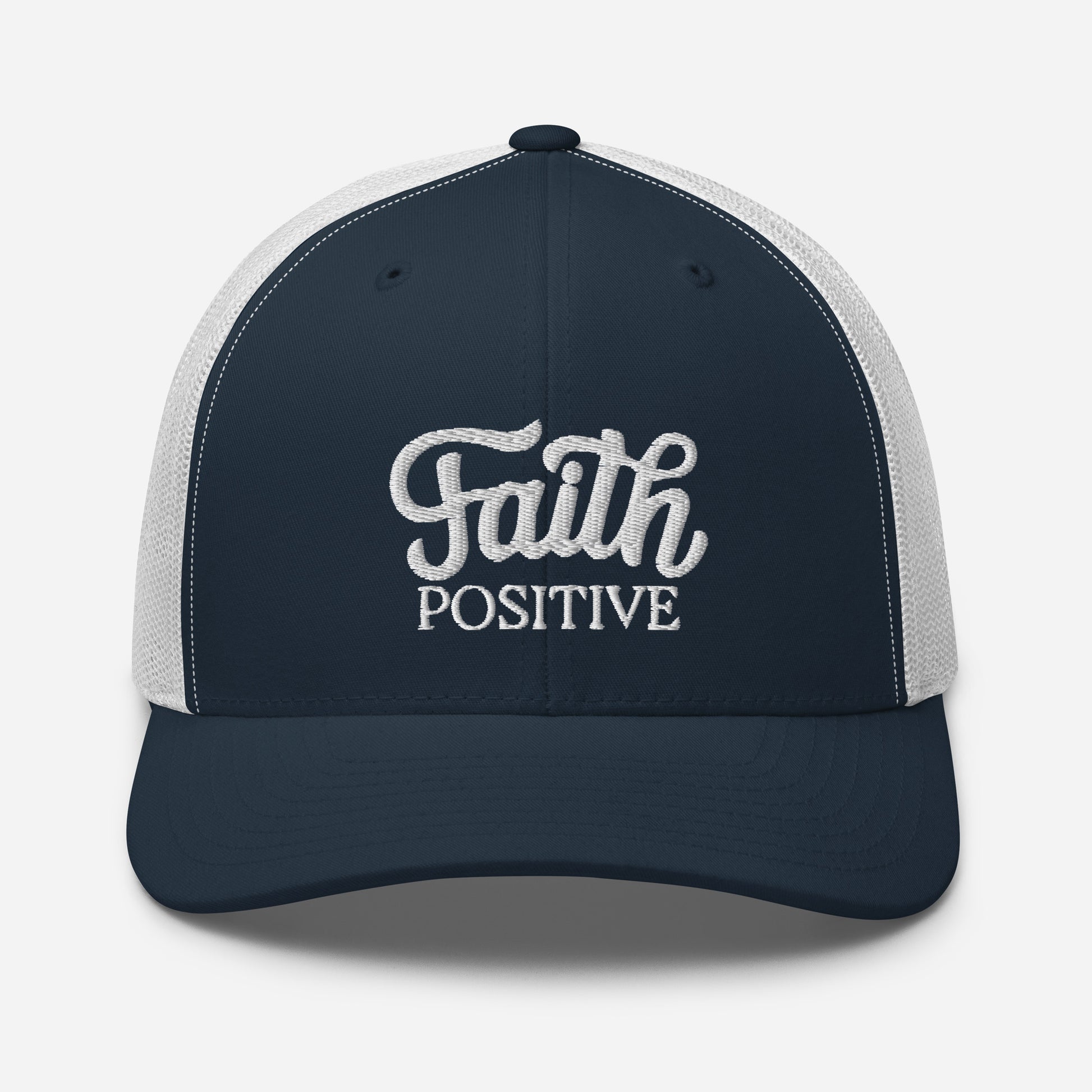 This is the Faith Positive Original trucker hat. The Faith Positive logo is embroidered on the front with white thread. This hat has a white mesh back with a navy blue front and bill. This is the front view of the product.