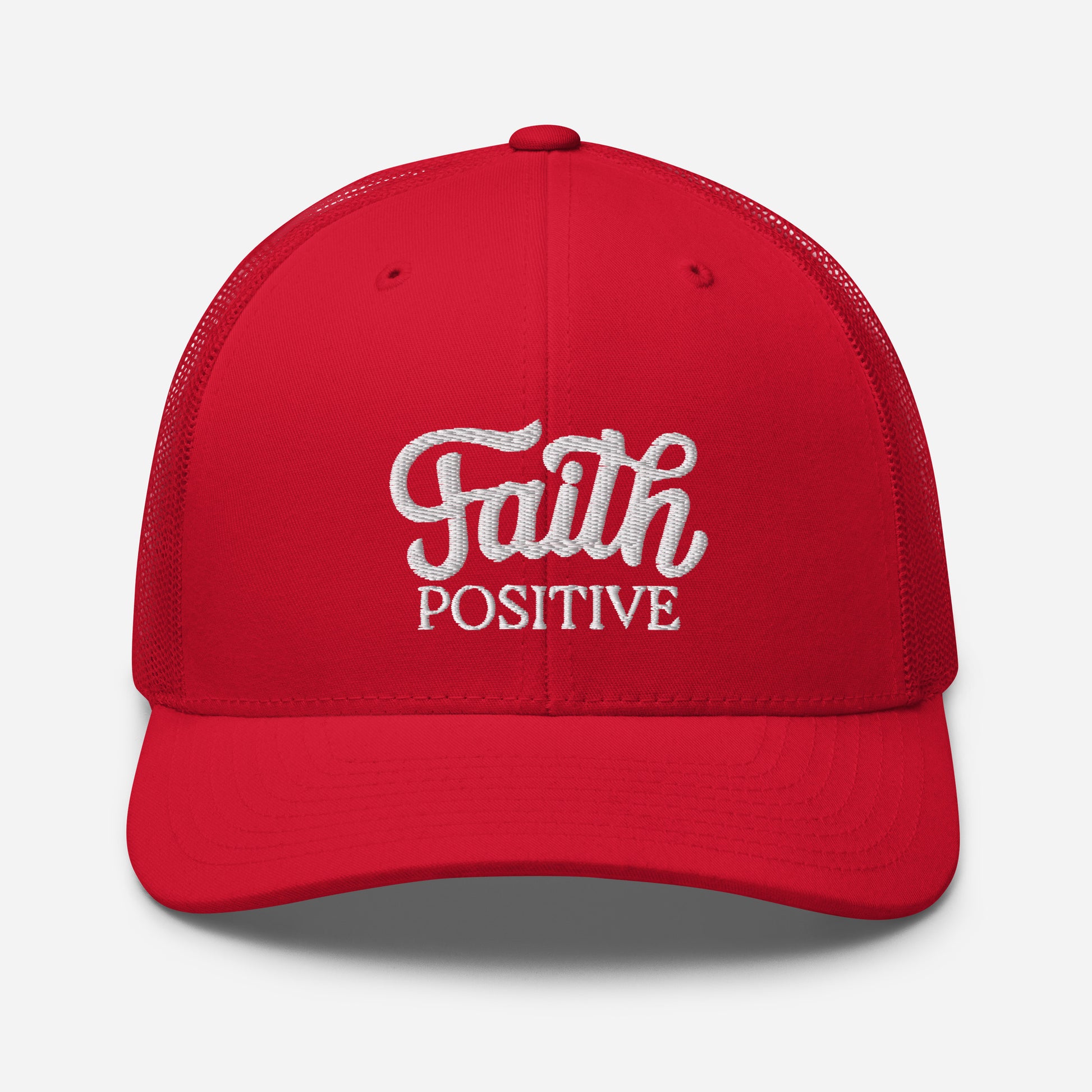 This is the Faith Positive Original trucker hat. The Faith Positive logo is embroidered on the front with white thread. This hat has a red mesh back with a red front and bill. This is the front view of the product.