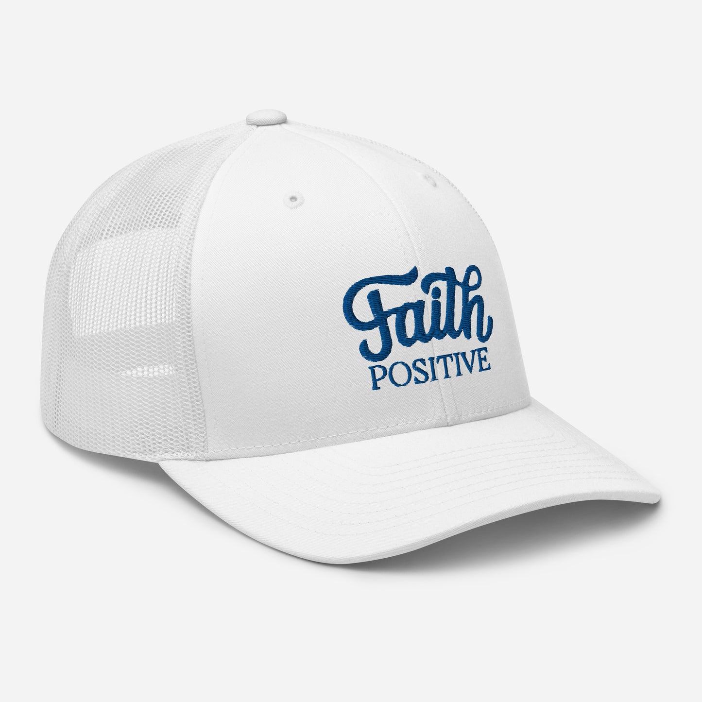 This is the Faith Positive Original trucker hat. The Faith Positive logo is embroidered on the front with blue thread. This hat is white in color. Side view of the product.